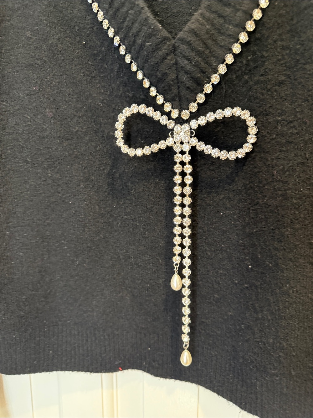 Express size medium Black V-Neck Sweater with Crystal Bow Accent - Picture 2 of 3